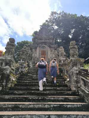 Climbing ancient Kehen temple stairs